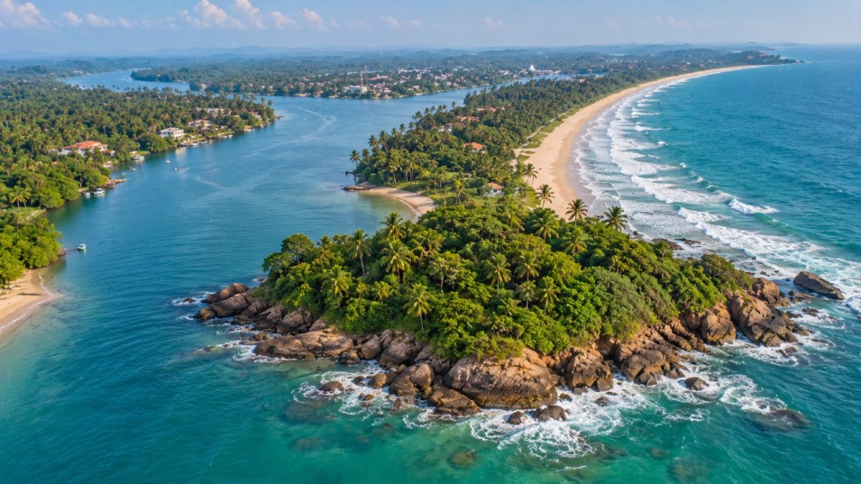 Golden sandy coastline and blue water in southwest Sri Lanka